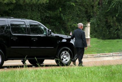 Funeral Chauffer Service – Man walking along the car to funeral Funeral Chauffer Service - Man walking along the car to funeral